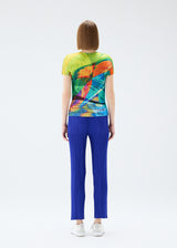 A model wears the PLEATS PLEASE ISSEY MIYAKE  VOYAGER top