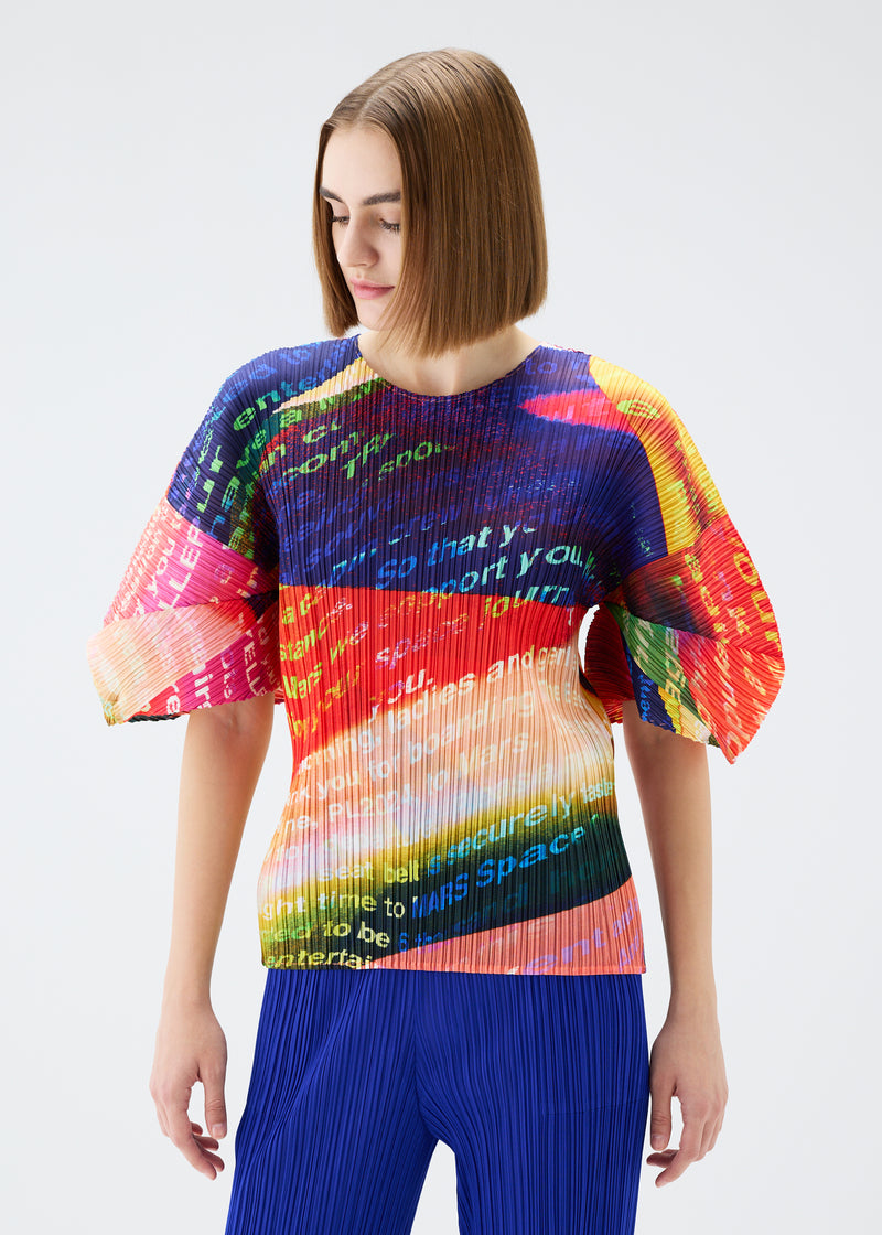 A model wears the PLEATS PLEASE ISSEY MIYAKE  VOYAGER top