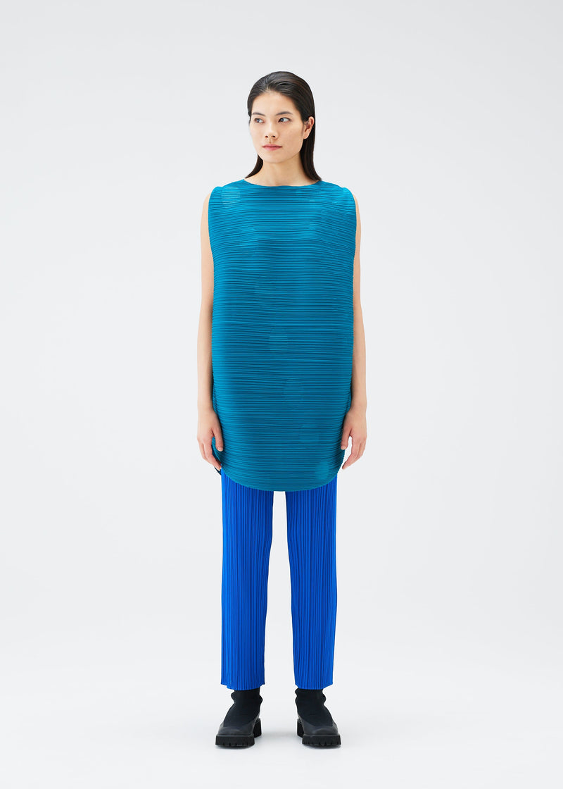 A model wears the PLEATS PLEASE ISSEY MIYAKE ORBIT tunic.