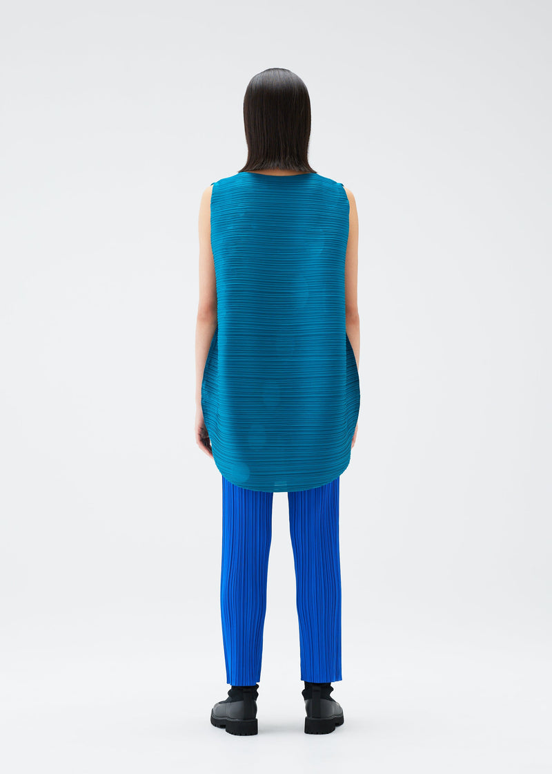 A model wears the PLEATS PLEASE ISSEY MIYAKE ORBIT tunic.