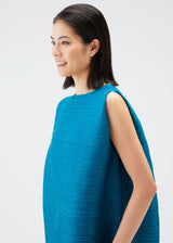 A model wears the PLEATS PLEASE ISSEY MIYAKE ORBIT tunic.