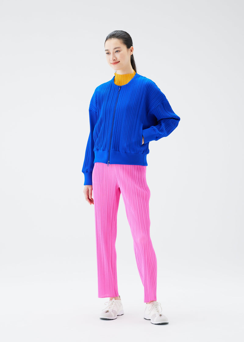 A model wears the PLEATS PLEASE ISSEY MIYAKE CREPE KNIT jacket.