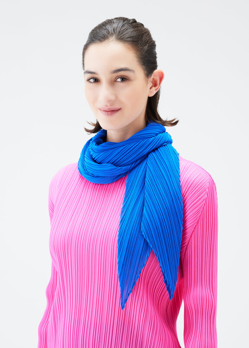 A model wears the PLEATS PLEASE ISSEY MIYAKE MONTHLY SCARF OCTOBER stole.