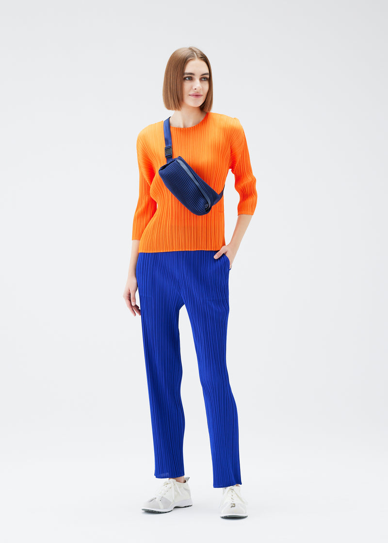 A model wears the PLEATS PLEASE ISSEY MIYAKE  BIAS PLEATS WAISTBAG bag